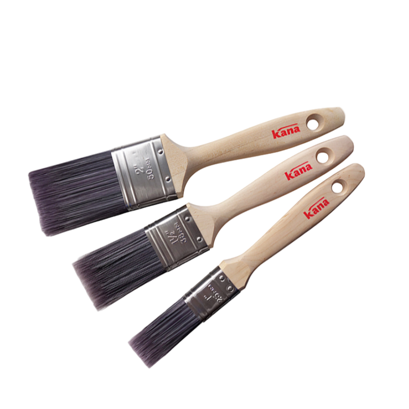 Three Kana paint brushes with wooden handles on a white background